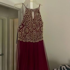 Used once. Burgundy and gold floor length. Has had slight alterations.